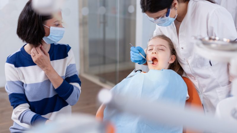 family-visit-at-dentist-office-for-dental-check-up.jpg